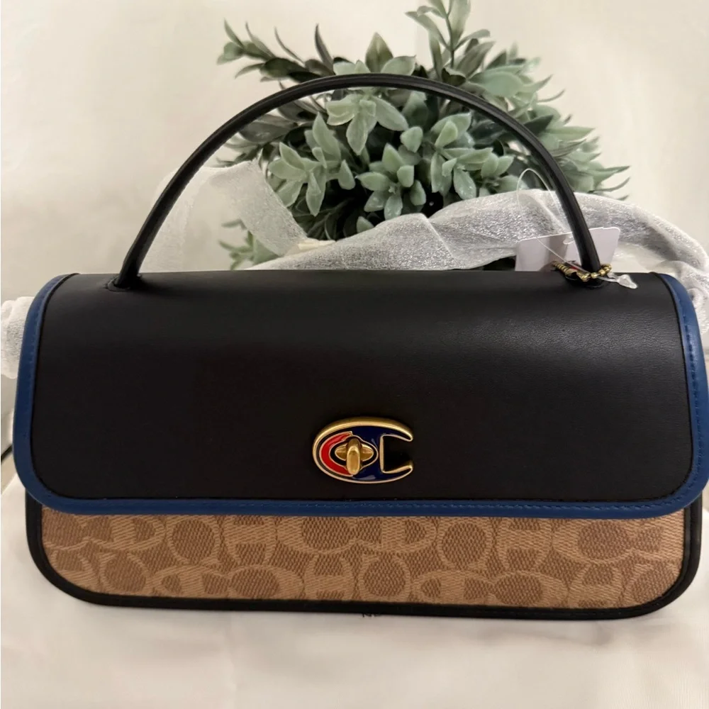Coach X Champion Turnlock Clutch In Signature Canvas